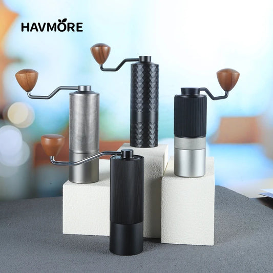 Manual burr coffee grinder in black and silver stainless steel