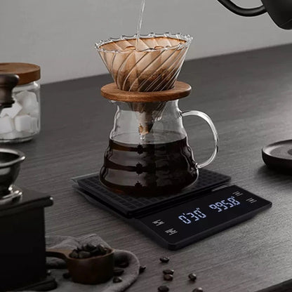 Pour-over coffee brewing on the digital scale with timer