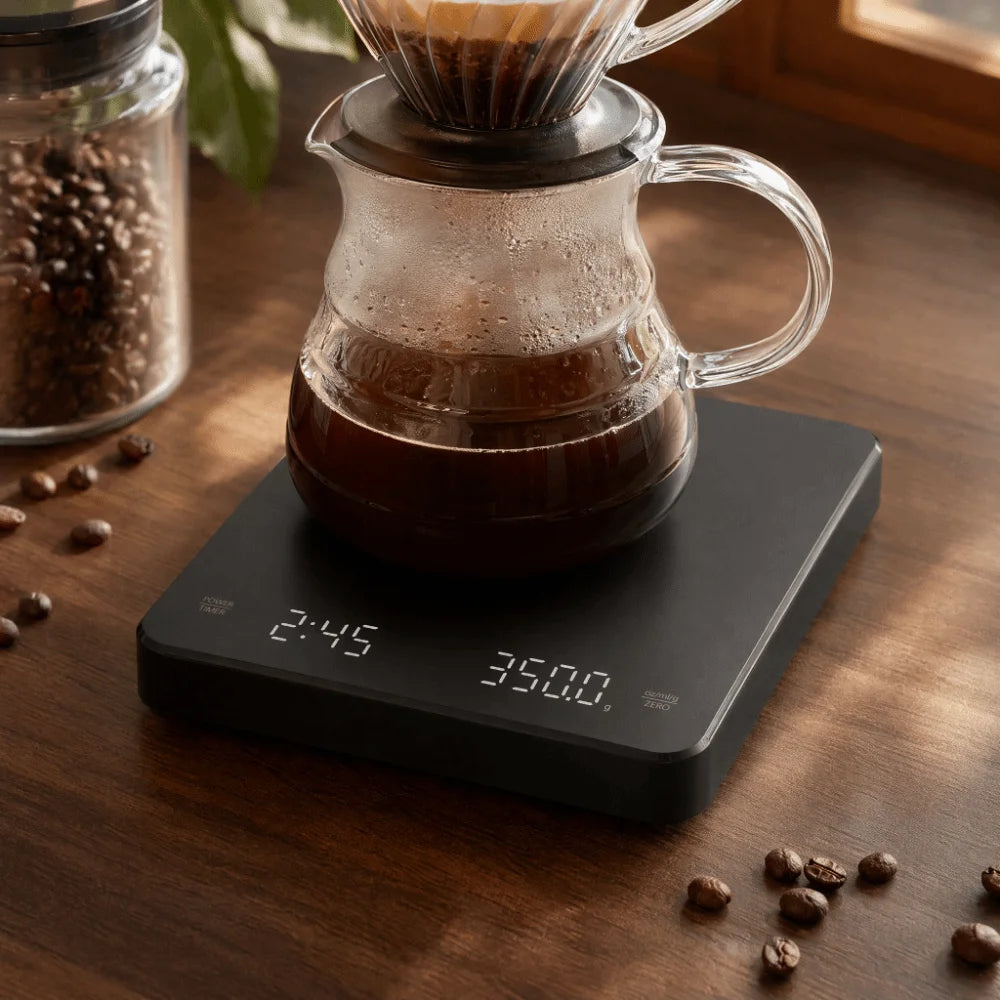 Digital coffee scale with timer under a pour-over brewer